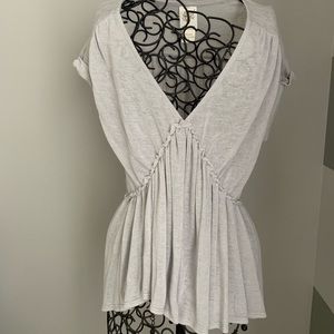 Flowy, grey, deep V shirt.